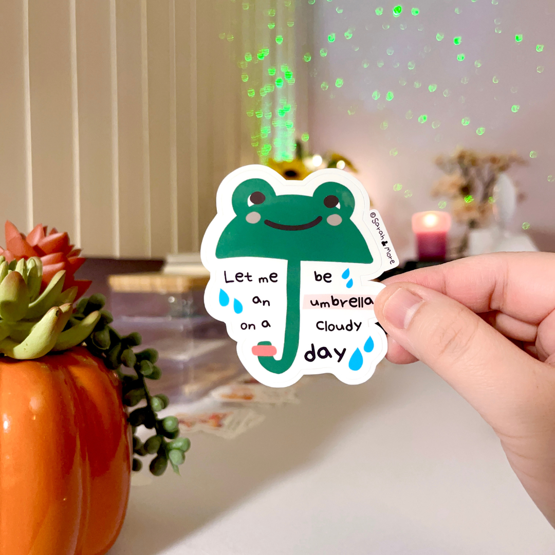 Crafting Whimsy in the Rain: The Tale Behind Our Frog Umbrella Sticker